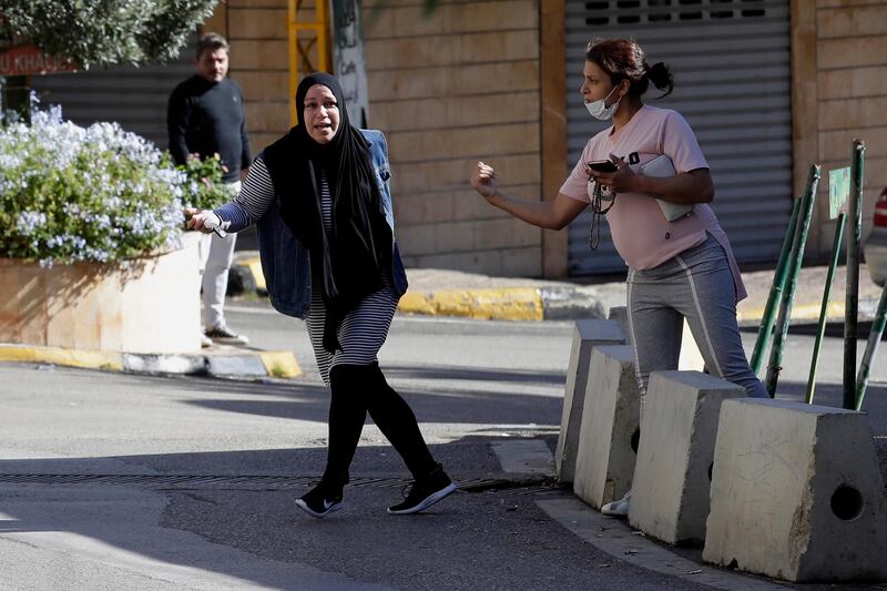 A relative of a prisoner reacts outside the detention center of Baabda courthouse compound. AP