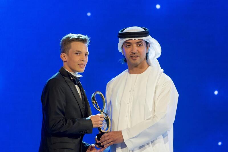 Sheikh Hazza bin Zayed presents a 2013 Abu Dhabi Award to Dominik Vugrinec, a 14-year-old Croatian student at Al Raha International School. Motivated by a diagnosis of scoliosis two years ago, Dominik led a campaign to screen his fellow students from the medical condition in which a person’s spine is curved. His campaign was adopted by other schools and now hundreds of students have been screened. Ryan Carter / Crown Prince Court — Abu Dhabi