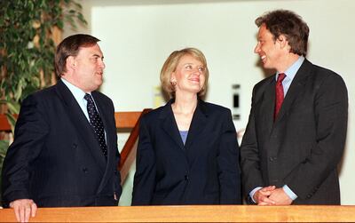 Then prime minister Tony Blair, right, and deputy prime minister John Prescott with Margaret McDonagh in 2004. Getty Images