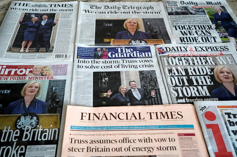 Front pages of a selection of British national newspapers, each leading with a story about Ms Truss becoming Britain's new prime minister. AFP