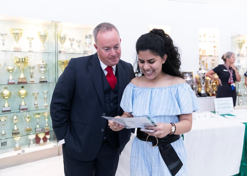 DUBAI, UNITED ARAB EMIRATES. 15 AUGUST 2019. 
Ebani Dhawan receives her A-Level results, with the Prinicipal Simon O’Connor, at Jumeirah College school.
(Photo: Reem Mohammed/The National)

Reporter:
Section: