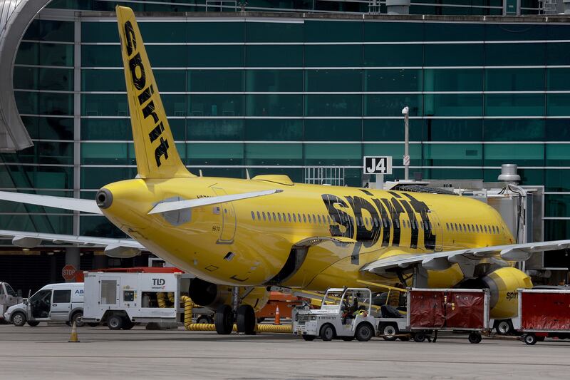 A Spirit plane is prepared for flight as it sits by a gate at Miami International Airport in Florida. AFP