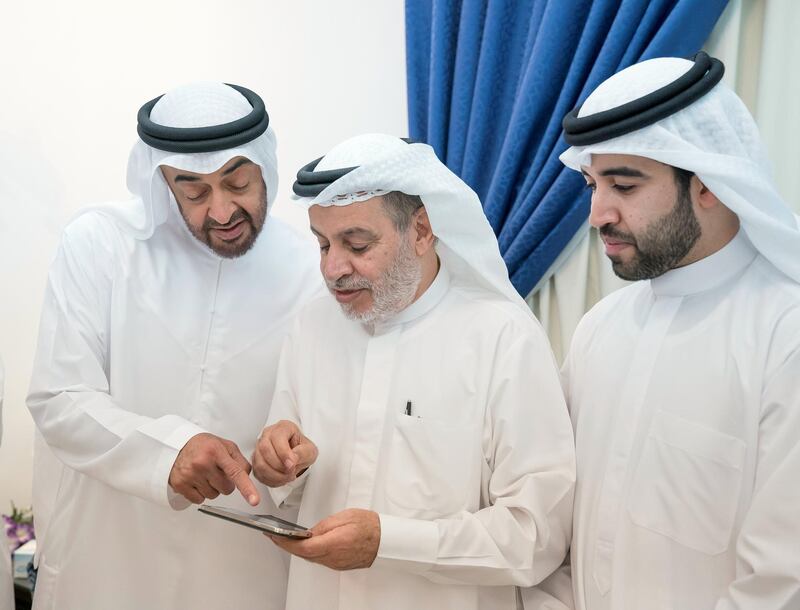 ABU DHABI, UNITED ARAB EMIRATES - October 09, 2017: HH Sheikh Mohamed bin Zayed Al Nahyan, Crown Prince of Abu Dhabi and Deputy Supreme Commander of the UAE Armed Forces (L) visits the home of his former teacher, Ahmed Mandi (2nd L), at Khalifa City.
( Mohamed Al Hammadi / Crown Prince Court - Abu Dhabi )
---