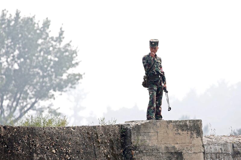 A North Korean soldier stands on the bank of the Yalu River in Sinuiju, North Korea, which borders Dandong in China's Liaoning province, September 9, 2017. REUTERS/Aly Song