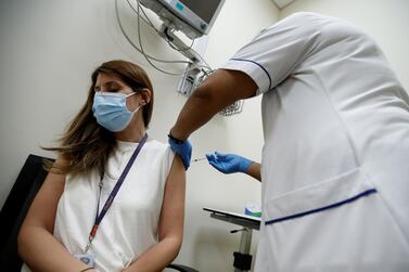  A woman receives a dose of the Pfizer-BioNTech Covid-19 vaccine at Zabeel Health Center in Dubai. EPA