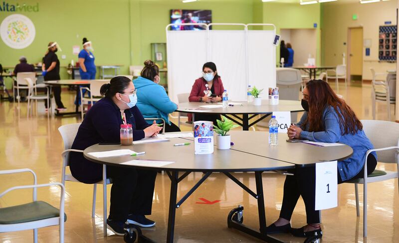 Prospective employees are interviewed during a job fair in Huntington Park, California. Businesses are having a hard time finding enough workers to fill available positions. AFP