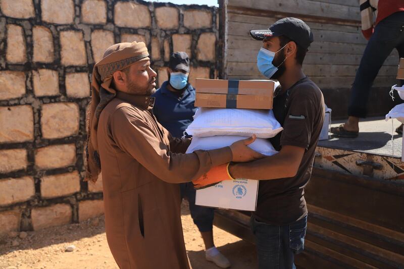 One of the relief workers during the distribution of food aids.