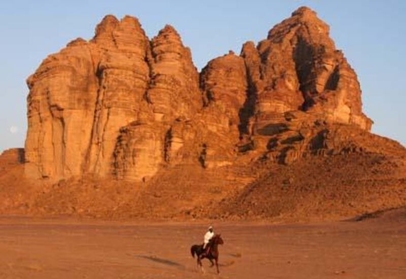 A jockey competes with his horse in the Wadi Rum International Endurance Ride in the Jordanian desert on November 14, 2008. Dubai ruler Sheikh Mohammed bin Rashed al-Maktoum, who is also Emirati vice president and prime minister, won the 120-km race. AFP PHOTO/AWAD AWAD *** Local Caption ***  707904-01-08.jpg