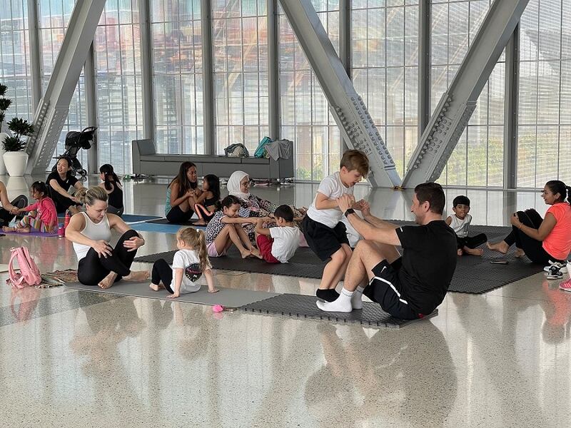 A parent-and-child yoga session at The Galleria mall in Abu Dhabi. Photo: Galleria Mall