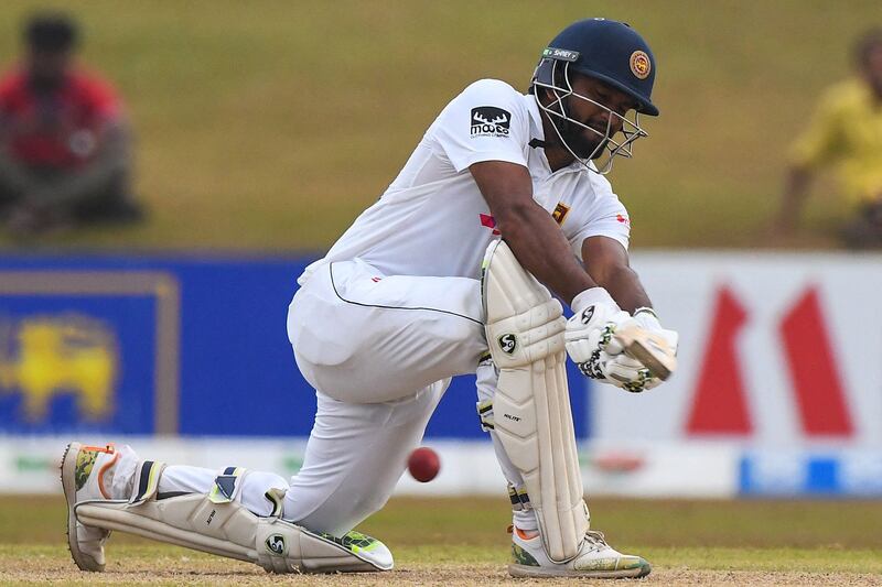 Sri Lanka's captain Dimuth Karunaratne plays a shot during the third day of play of the second cricket Test match between Sri Lanka and Pakistan at the Galle International Cricket Stadium in Galle on July 26, 2022.  (Photo by ISHARA S.  KODIKARA  /  AFP)