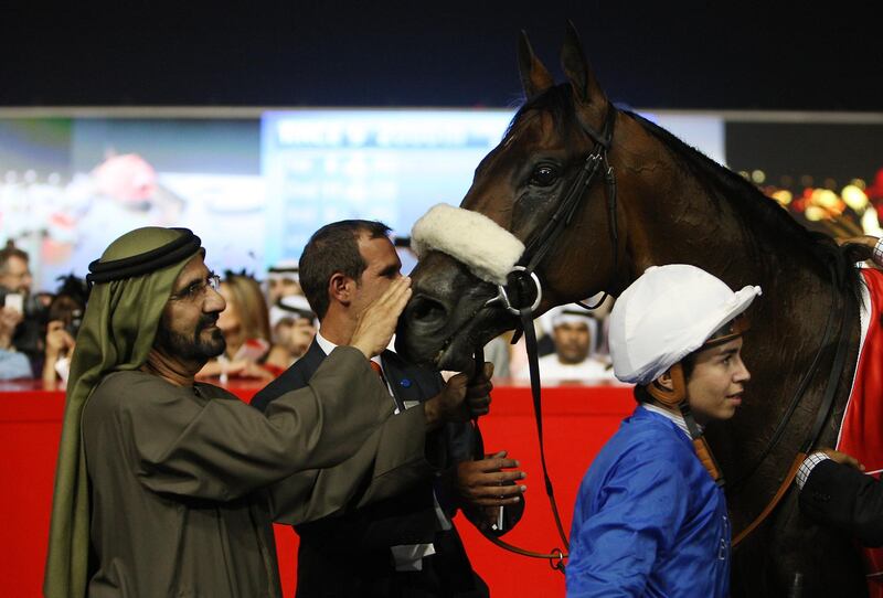 DUBAI , UNITED ARAB EMIRATES Ð Mar 31 :  Sheikh Mohammed Bin Rashid Al Maktoum , Vice President and Prime Minister of UAE with Monterosso ( GB ) ridden by Mickael Barzalona ( right ) after winning the Dubai World Cup ( 2000m All Weather ) worlds richest horse race at Meydan Racecourse in Dubai. The trainer is Mahmoud Al Zarooni. ( Pawan Singh / The National ) 