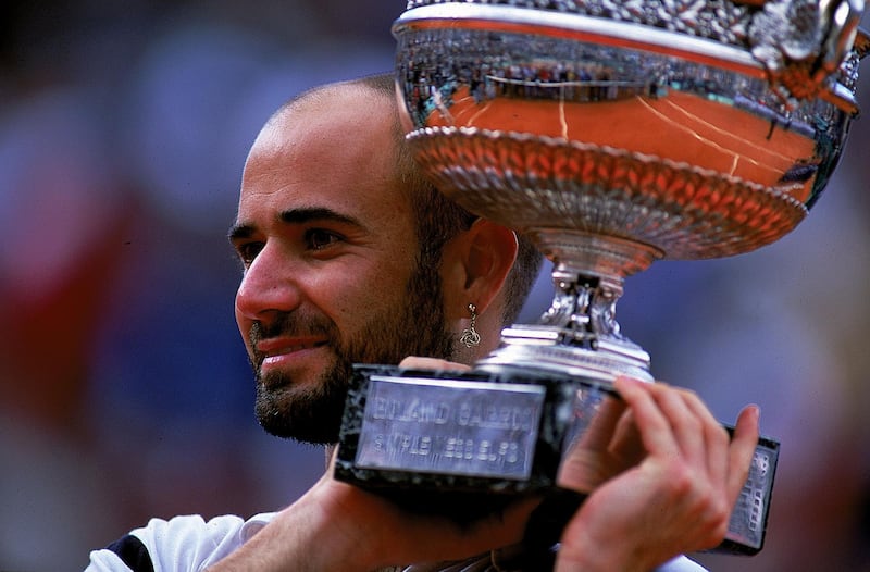 6 Jun 1999: Andre Agassi of the USA holds up the trophy after defeating Andrei Medvedev of the Ukraine to win the men's singles final of the French Open at Roland Garros in Paris, France. Getty Images