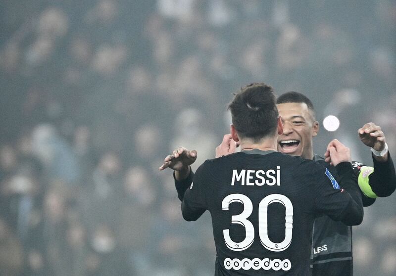 Paris Saint-Germain's Argentinian forward Lionel Messi celebrates with Kylian Mbappe. AFP