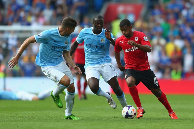 CARDIFF, WALES - AUGUST 25:  Fraizer Campbell (R) of Cardiff City runs at Yaya Toure (C) and Javier Garcia (L) of Manchester City during the Barclays Premier League match between Cardiff City and Manchester City at Cardiff City Stadium on August 25, 2013 in Cardiff, Wales.  (Photo by Michael Steele/Getty Images) *** Local Caption ***  177642412.jpg