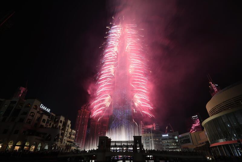 Fireworks illuminate the sky around Burj Khalifa. EPA