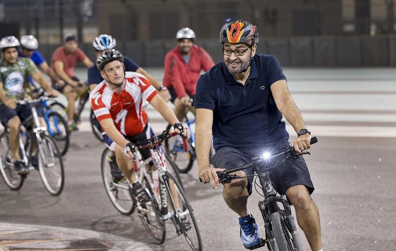 Sheikh Mohammed shows the way: the Crown Prince of Abu Dhabi and Deputy Supreme Commander of the Armed Forces cycles around Yas Marina Circuit last year during the weekly TrainYAS event. The National's latest healthy living initiative encourages readers to follow the Crown Prince's example. Ryan Carter / Crown Prince Court Abu Dhabi
