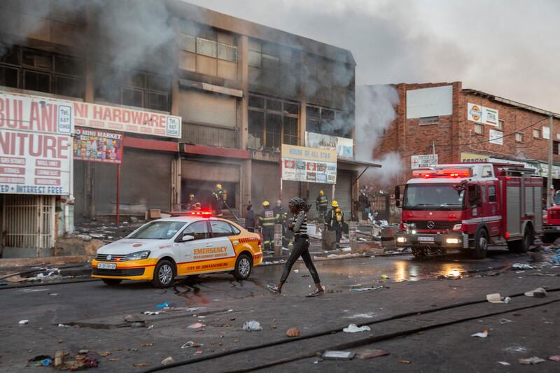 A looted shop on fire in Alexandra township, Johannesburg. At least six people have been killed and more than 200 arrested in the ensuing violence.