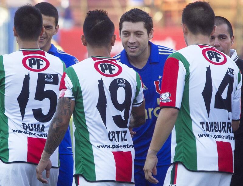 Deportivo Palestino, a first division football club in Chile, have been barred from using shirts with the number '1' in the shape of a map of Palestine. Claudio Reyes / AFP