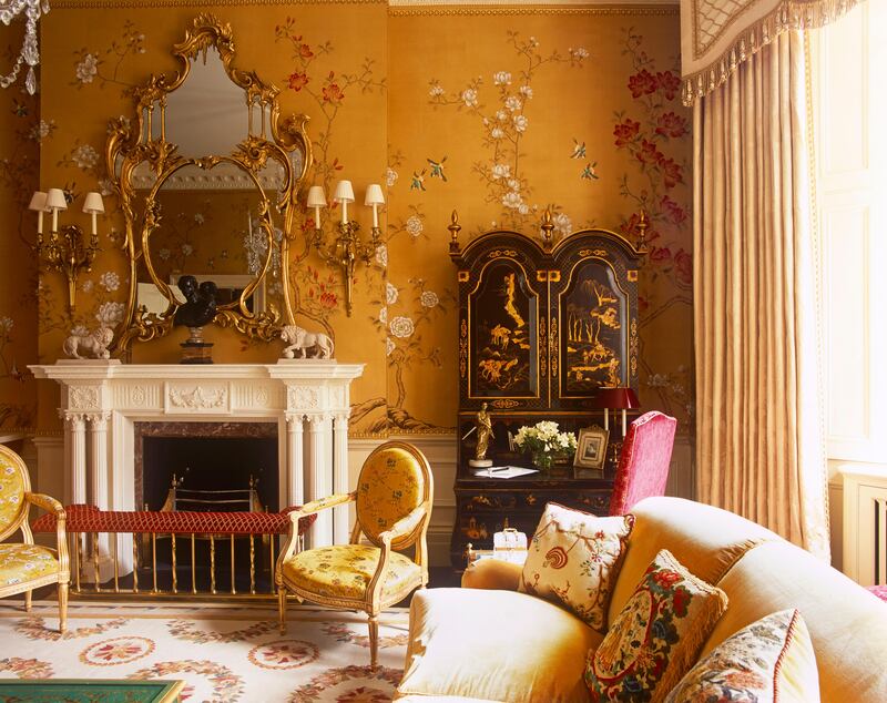 â€˜A well designed room is timeless and lasting, it must look good at different times of the day in both natural and artificial light.â€™ This drawing room overlooks a typically charming London square; the de Gournay wallpaper, colored specifically to this intense mustard shade, sets the tone for the rest of the decoration. The balance of colors is achieved through the repeated use of off-white in the curtains, the fire surround and the Aubusson rug and all echo the white flowers in the chinoiserie wallpaper.
â€˜I insist on mixing old and new furniture. Here the mirror and the wall brackets are antique, while the Japanned secrÃ©taire has been made from reclaimed antique elements. Both the Howard sofa and Louis XVI-style chairs have been made for this space. I have no problem using new reproductions furniture as long as it has the right look and made using the correct techniques; otherwise they might feel fake and ultimately fail the room.â€™

(Photo by James McDonald) *** Local Caption ***  WK19JL-HH-ALIDAD03.jpg