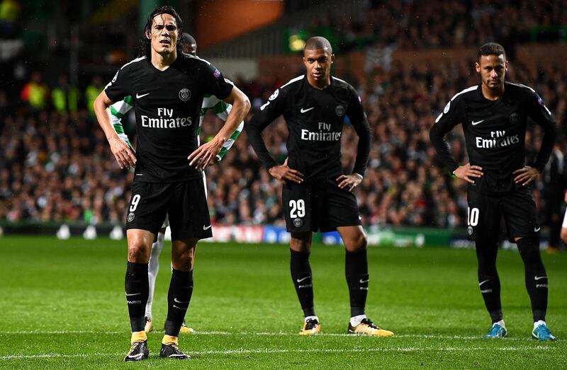 Paris Saint-Germain's Uruguayan striker Edinson Cavani (L), Paris Saint-Germain's French striker Kylian Mbappe (C) and Paris Saint-Germain's Brazilian striker Neymar gesture during the UEFA Champions League Group B football match between Celtic and Paris Saint-Germain (PSG) at Celtic Park in Glasgow, on September 12, 2017. (Photo by FRANCK FIFE / AFP)