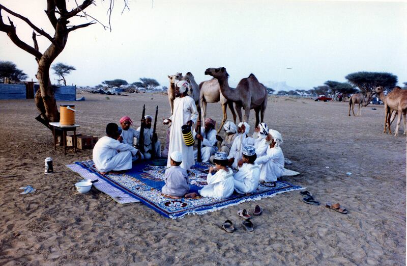 Omanis drink coffee at an open-air majlis near Buraimi town. Photo: Jawad Ibrahim