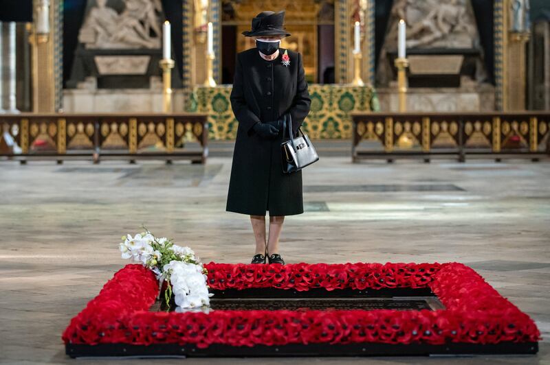 Queen Elizabeth inspects a bouquet of flowers placed on her behalf at the grave of the Unknown Warrior in 2020 to mark the centenary of the burial of the Unknown Warrior