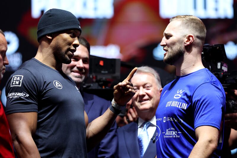 Anthony Joshua, left, and Otto Wallin of Sweden face-off. Getty Images
