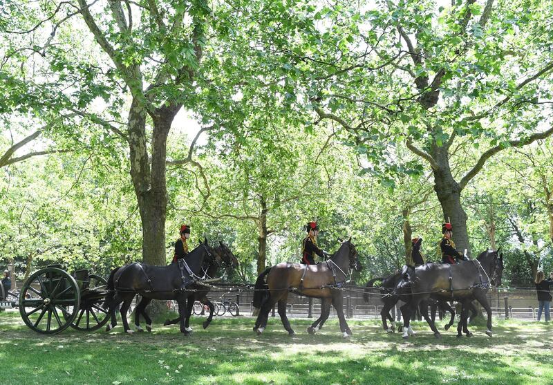 Members of the King's Troop Royal Horse Artillery ride during a 82-gun double gun salute in Green Park.  EPA