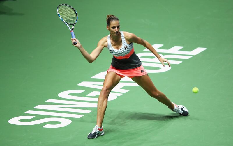SINGAPORE - OCTOBER 22:  Karolina Pliskova of Czech Republic stretches for a forehand in her singles match against Venus Williams of the United States during day 1 of the BNP Paribas WTA Finals Singapore presented by SC Global at Singapore Sports Hub on October 22, 2017 in Singapore.  (Photo by Clive Brunskill/Getty Images)