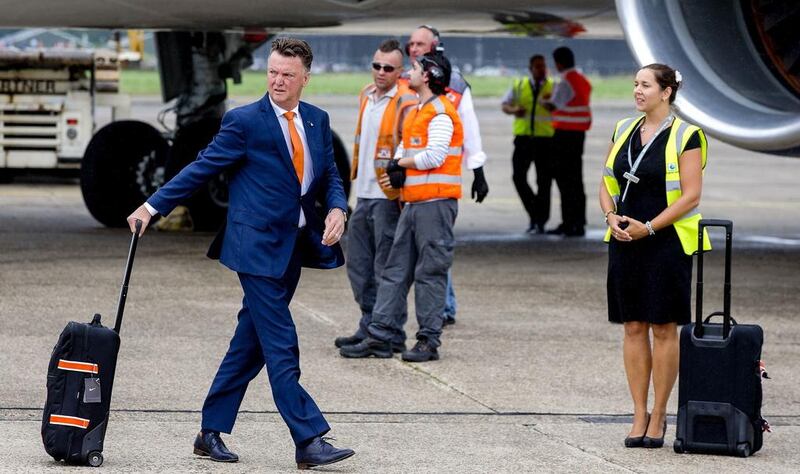 Netherland's football coach Louis van Gaal arrives at Rotterdam-The Hague airport in Rotterdam, on July 13, 2014. Van Gaal starts as Manchester United manager this week. AFP PHOTO / ANP / SANDER KONING