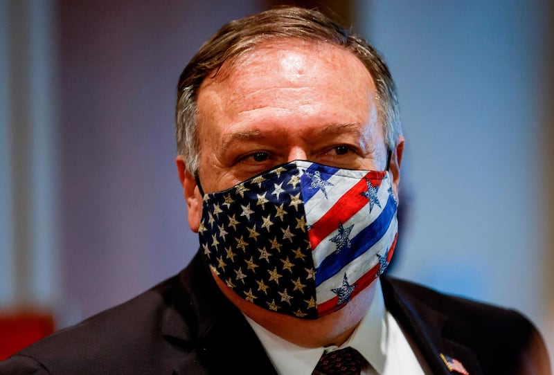 US Secretary of State Mike Pompeo wears a stars and stripes facemask as he departs a meeting with members of the UN Security Council about Iran's alleged non-compliance with a nuclear deal at the United Nations in New York, on August 20, 2020. / AFP / POOL / MIKE SEGAR
