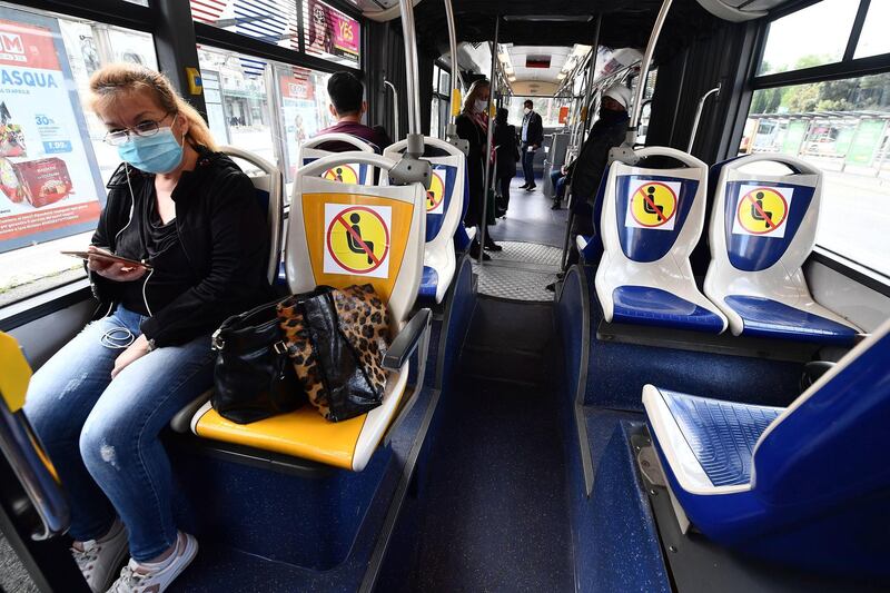 Passengers on public transport in Rome on the first day of easing the national lockdown. EPA