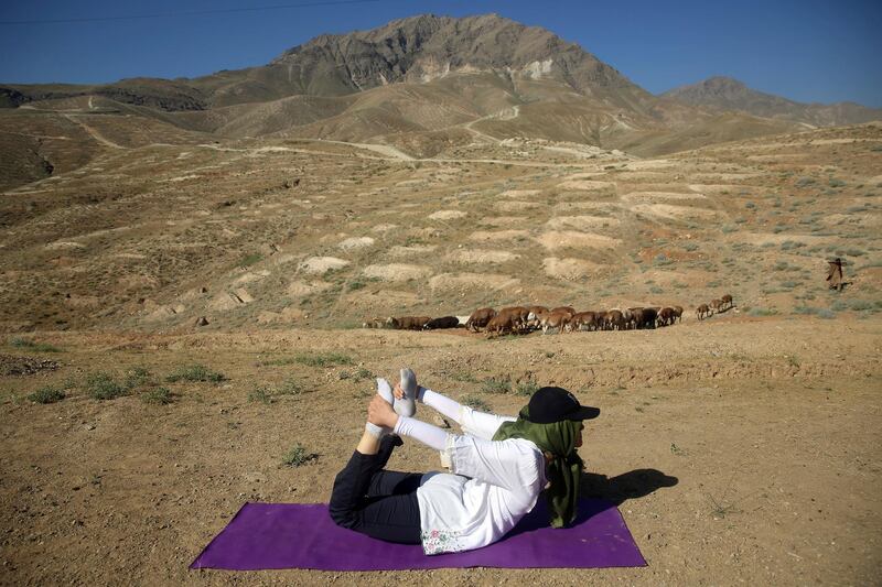 An Afghan enthusiast performs yoga to mark International Yoga Day on the outskirts of Kabul, Afghanistan. AP Photo