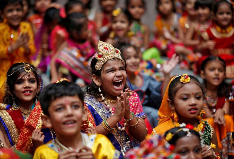 Children celebrate Janmashtami festival, marking the birth anniversary of Hindu Lord Krishna, at a school in Ahmedabad, India. Reuters
