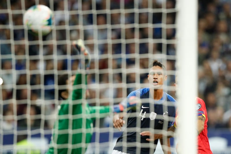 France's Raphael Varane looks at the ball as Clement Lenglet scores France's second goal. EPA