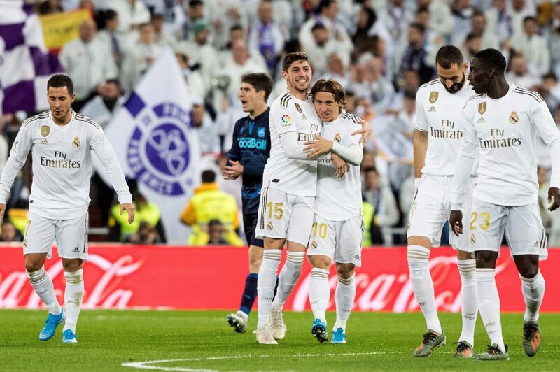 Real midfielder Fede Valverde (C) celebrates with his teammates after giving his side a 2-1 lead against Real Sociedad.  EPA