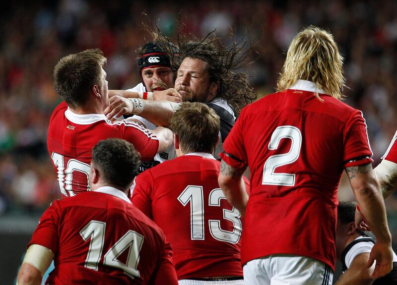 Barbarians' Martin Castrogiovanni (C) confronts British and Irish Lions' Owen Farrell (10) during their friendly match in Hong Kong June 1, 2013.   REUTERS/Tyrone Siu (CHINA - Tags: SPORT RUGBY) *** Local Caption ***  HKG109_RUGBY-_0601_11.JPG