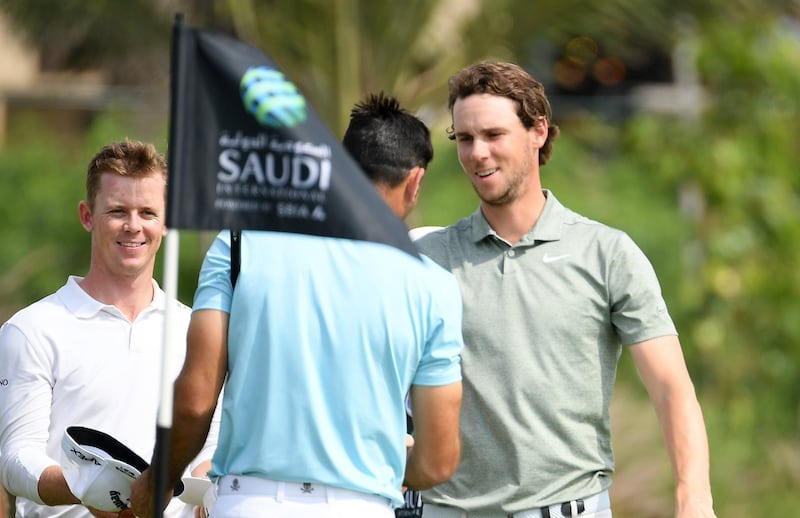 KING ABDULLAH ECONOMIC CITY, SAUDI ARABIA - JANUARY 31:  Brandon Stone of South Africa, Alvaro Quiros of Spain and Thomas Pieters of Belgium on the 9th green during the first round of the Saudi International at the Royal Greens Golf & Country Club on January 31, 2019 in King Abdullah Economic City, Saudi Arabia. (Photo by Ross Kinnaird/Getty Images)