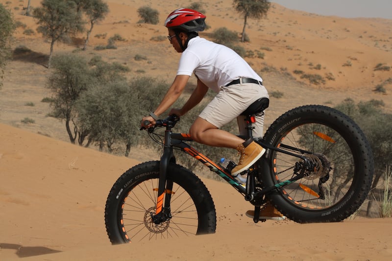 Gabriel Gutsa, recreation manager of The Ritz-Carlton Ras Al Khaimah, Al Wadi Desert, says fat biking is a great way to explore the desert and dunes. Photo: The Ritz Carlton Al Wadi Desert