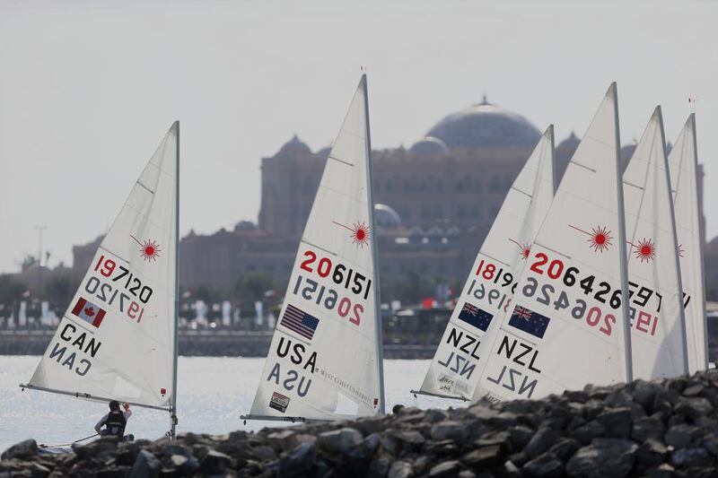 Boats line up along the breakwater as they come in during the ISAF Sailing World Cup in Abu Dhabi on Saturday, November 29, 2014. DELORES JOHNSON / The National