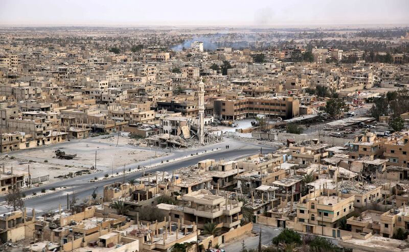 A picture taken from a helicopter during a press tour provided by the Russian Armed Forces on September 15, 2017 shows an aerial view of the modern city of Palmyra, in Syria's central province of Homs. / AFP PHOTO / France2 / Dominique DERDA