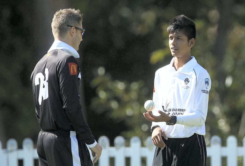 SYDNEY, AUSTRALIA - SEPTEMBER 24:  Michael Clarke of Western Suburbs talks to team mate Sandeep Lamichhane before the Mosman v Western Suburbs first grade match at Allan Border Oval on September 24, 2016 in Sydney, Australia.  (Photo by Mark Metcalfe/Getty Images)