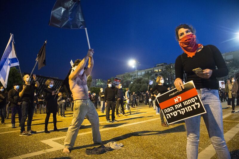Thousands of Israelis gather at an Anti-Corruption rally under coronavirus restrictions, decries proposed unity government talks between Israeli Prime Minister, Benjamin Netanyahu, and Blue and White Party leader, Benny Gantz.  Getty Images