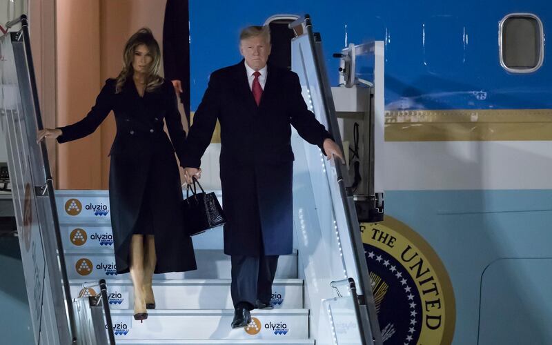 epa07154559 US President Donald J. Trump (R) and First Lady Melania Trump (L) disembark from Air Force One upon their arrival at Orly airport, near Paris, France, 09 November 2018. US President Trump along with other Heads of States and Governments will join the commemoration ceremonies for their countries' fallen WW1 soldiers in France.  EPA/IAN LANGSDON