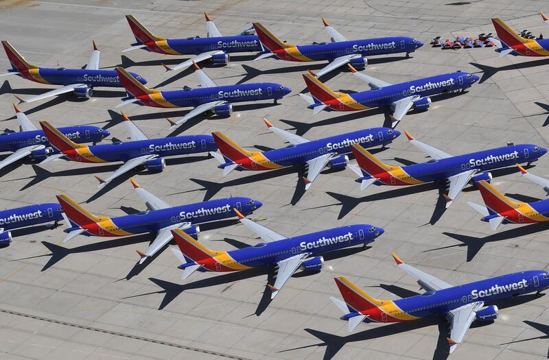 (FILES) In this file photo taken on March 28, 2019 Southwest Airlines Boeing 737 MAX aircraft are parked on the tarmac after being grounded, at the Southern California Logistics Airport in Victorville, California. The Federal Aviation Administration said September 23, 2019, that it still has no timeframe to lift the grounding of the Boeing 737 MAX, and that individual countries will decide when the plane can fly again. / AFP / Mark RALSTON
