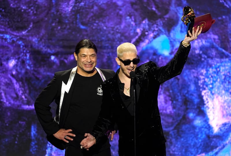Robert Trujillo, left, and Andrew Watt accept the award for Best Rock Album on behalf of Ozzy Osbourne for Patient Number 9. AP
