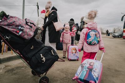 Angelina, 3, and Arina, 5, crossed the border with their mother Natasha to safety in Moldova, March 6, 2022