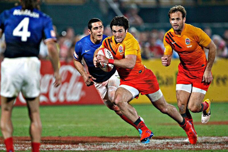 Dubai December 3, 2011 - England's Mat Turner runs up field against France in the finals of the Emirates Airlines Dubai Rugby Sevens tournament at the Rugby Sevens stadium in Dubai, December 3, 2011. Turner scored two tries as England defeated France 29-12. Turner was named Star of the Tournament. (Photo by Jeff Topping/The National)
