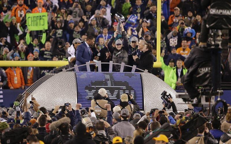 Seattle Seahawks owner Paul Allen holds up the Lombardi Trophy after the Super Bowl. Gregory Bull / AP  