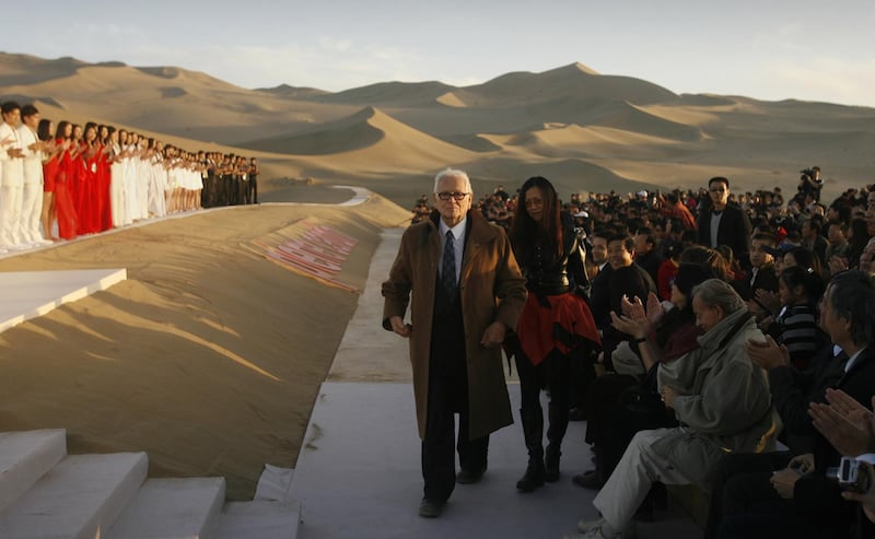 Pierre Cardin at the finale of his fashion show, in the desert of Whistling Sand Mountain on the outskirts of Dunhuang in China's northwest Gansu province, in October 2007. AFP
